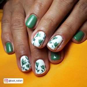 Pastel Green And White Nails With Flowers On Two Fingers