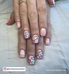 Peach Short Valentine Nails With Pastel Colored Cartoon Hearts