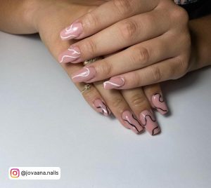Pink Nails With White Lines On One And Black Lines On The Other