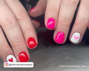 Pink, Red And White Short Valentine Nails With A Red And Pink Heart On The White Nails