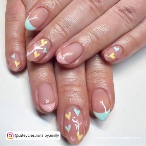 Pink, Yellow And Blue Pastel Short Valentine Nails On Nude Base With Pastel Hearts And French Tips