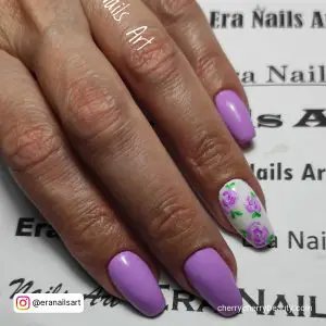 Purple And White Gel Nails With Flowers On One Finger