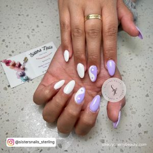 Purple And White Nail Art With Domino Design On Middle Finger