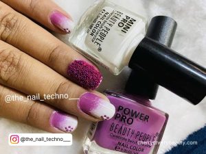 Purple And White Ombre Nails With Nail Polish Bottles