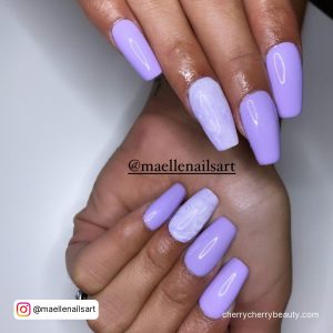 Purple Nails With White Flowers For A Fun Look