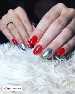 Red And Silver Gel Nails With Glitter On One Finger