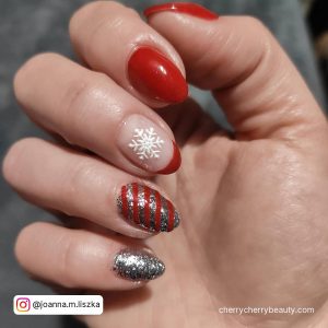 Red And Silver Nails With Snowflake On One Finger