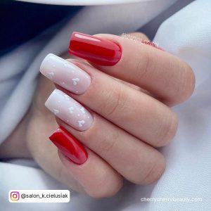 Red And White Square Tip Nails With White Hearts On The White Nails