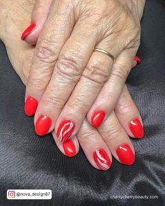 Red Nails With One Silver Glitter Nail