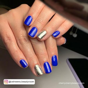 Royal Blue And Silver Nail Designs With Metallic Finish On One Nail