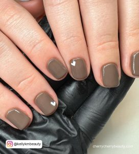 Short Brown Nails With Two Small White Hearts