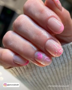 Short Nude Nails With Pink Tips And Pink And White Kiss Designs