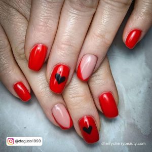 Short Red Nails With Red French Tip And Black Heart Designs