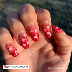 Short Round Tip Red Valentines Nails With White Hearts