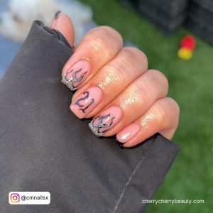 Short Square Tip Nude Nails With 21 Written In Black And Silver And Black Flame Design