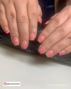 Short Square Tip Nude Nails With Pink Tips And Pink Hearts
