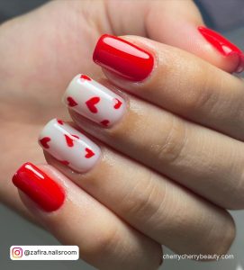 Short White And Red Valentine Nails With Red Hearts On White Nails