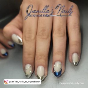 Silver And Navy Blue Nails With A Metallic Finish On Tips