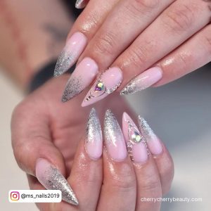 Silver And Pink Ombre Nails With Rhinestone On Ring Finger