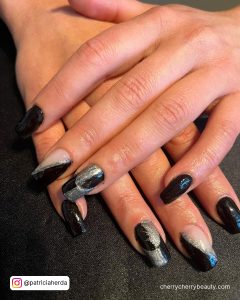 Silver Black Nails With Design On Two Fingers