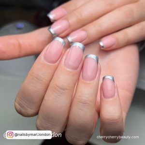 Silver Chrome French Tip Nails In Oval Shape