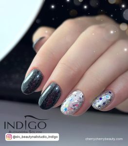 Silver Glitter Nails With Two Nails In Black