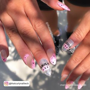Silver Glitter, Nude And Pink Almond Nails With Black Star Design And Cross Design