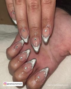 Silver Glitter Tip Acrylic Nails With A Silver Dot On Each Finger