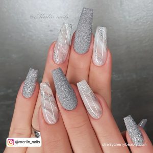 Silver Nail Polish With Marble Effect On Two Nails