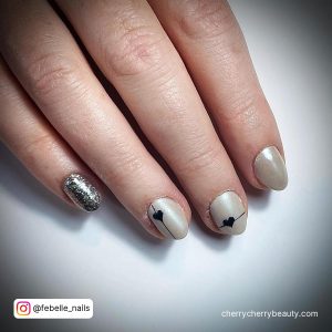 Silver Nails With Glitter And Black Hearts