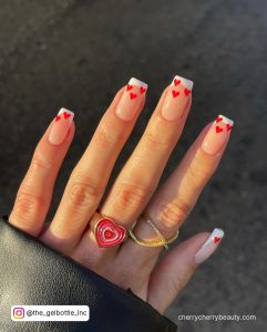 Simple And Short Square Tip Nails With Nude Base And White Tips With Red Hearts