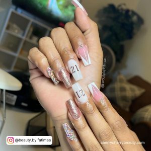 Square Tip White And Rose Gold Nails With V Tip French Tip, Glitter And 21 Written In Rose Gold
