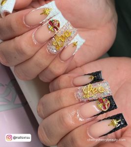 White And Black Square Tip French Tip Nails With Gold Chrome Designs And Gold Chrome Leo Writing