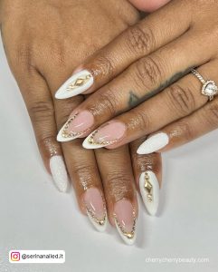 White And Gold Nails With Rhinestones With Ring In One Finger