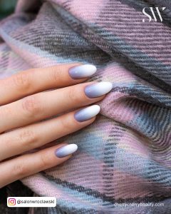 White And Gray Ombre Nails On A Purple Scarf