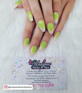 White And Green Ombre Nails On A Furry Surface