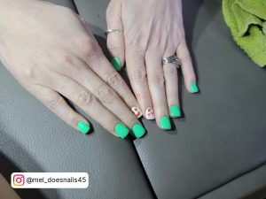 White And Neon Green Nails On A Car Seat