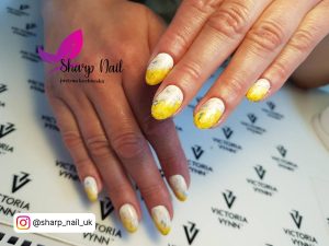 White And Neon Yellow Nails On A Table