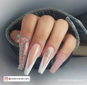 White And Nude Long French Tip Coffin Birthday Nails With Capricorn Writing, V Tip, Glitter And Capricorn Sign