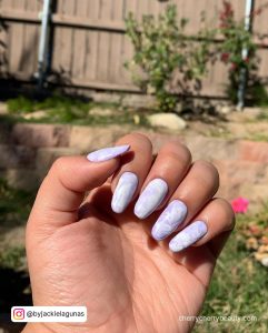White And Purple Nails In A Garden