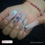 White And Rhinestone Nails With Flowers