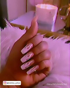White Flame Nails In Front Of A Lamp