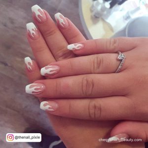 White Flame Nails Styled With A Ring