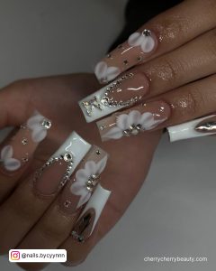 White French Tip Acrylic Nails With Rhinestones And Flowers
