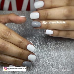 White Gray Nails On A Gray Surface