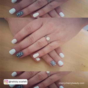 White Gray Nails Wearing A Ring
