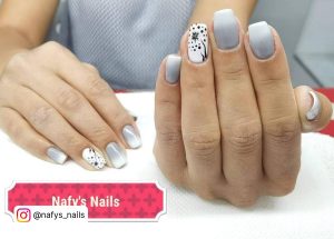 White Gray Ombre Nails With A Flower On Ring Finger