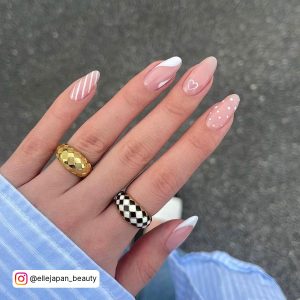 White Line Nail Designs With Rings On Two Fingers