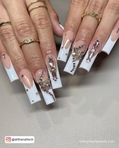 White Long Acrylic Nails With Diamonds And Pink Base Coat