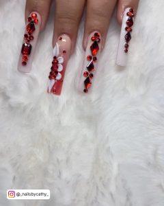 White Long Nails Designs With Red Diamonds